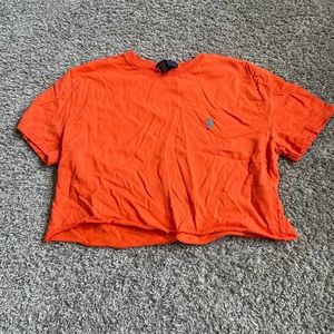 Cropped bright orange polo tee